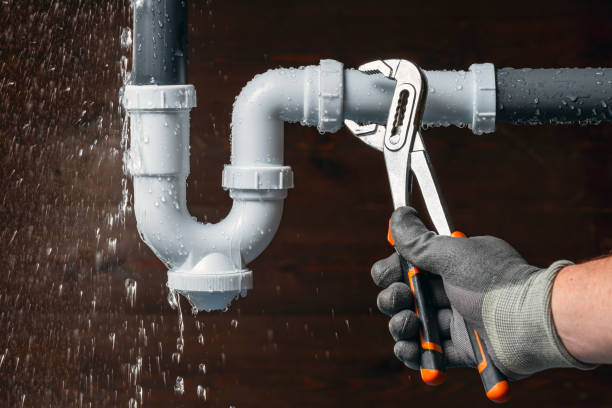 Professional Emergency Plumber technician working in Champaign, IL